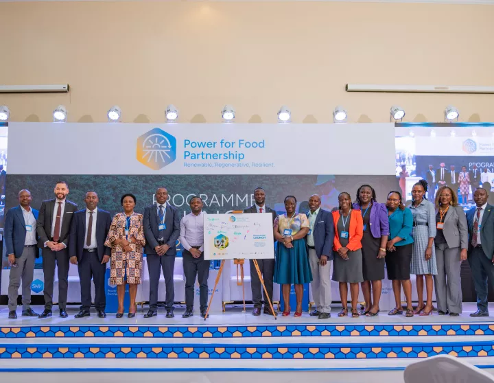 Partners and government representatives pose together at the Power for Food Partnership commitment board following the Uganda Programme Launch, Kampala, 2 December 2025. Photo: SNV