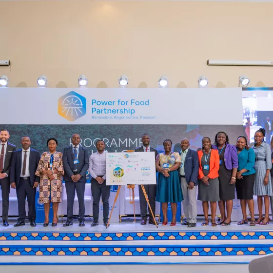 Partners and government representatives pose together at the Power for Food Partnership commitment board following the Uganda Programme Launch, Kampala, 2 December 2025. Photo: SNV