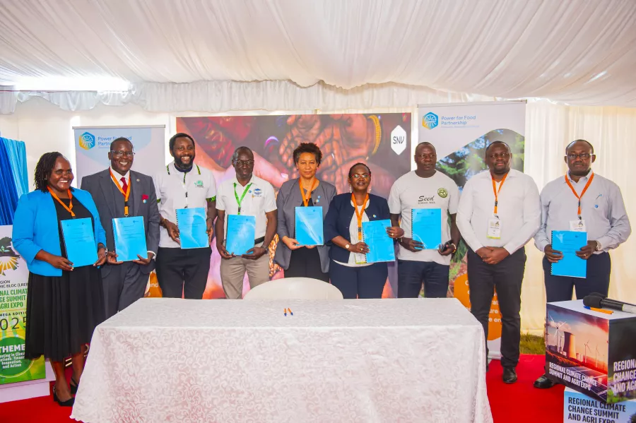 Partners celebrating the formal launch of the Power for Food Partnership in Kenya, posing with the signed Memorandum of Understanding in Kakamega, Kenya, on 15 October 2025. Photo: SNV