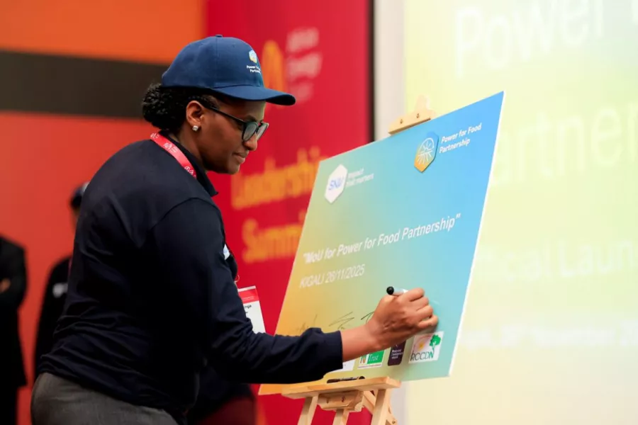 The partners are signing the Power for Food Partnership board during the launch event in Rwanda.